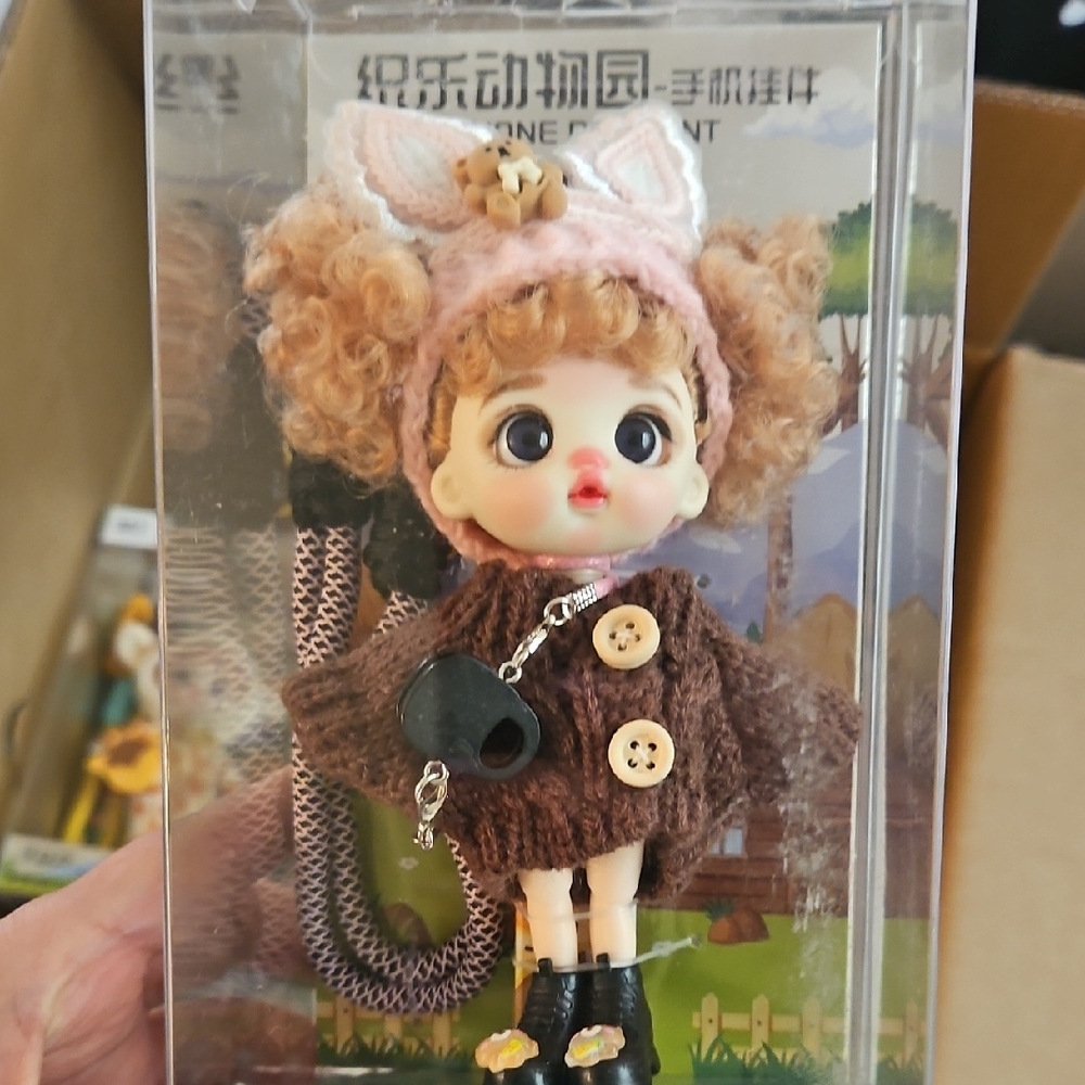 Luolifen Curly-Haired Doll in Brown Knit Coat and Pink Ear Headband